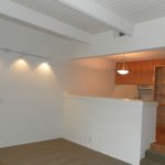 Interior of apartment living room with view to kitchen